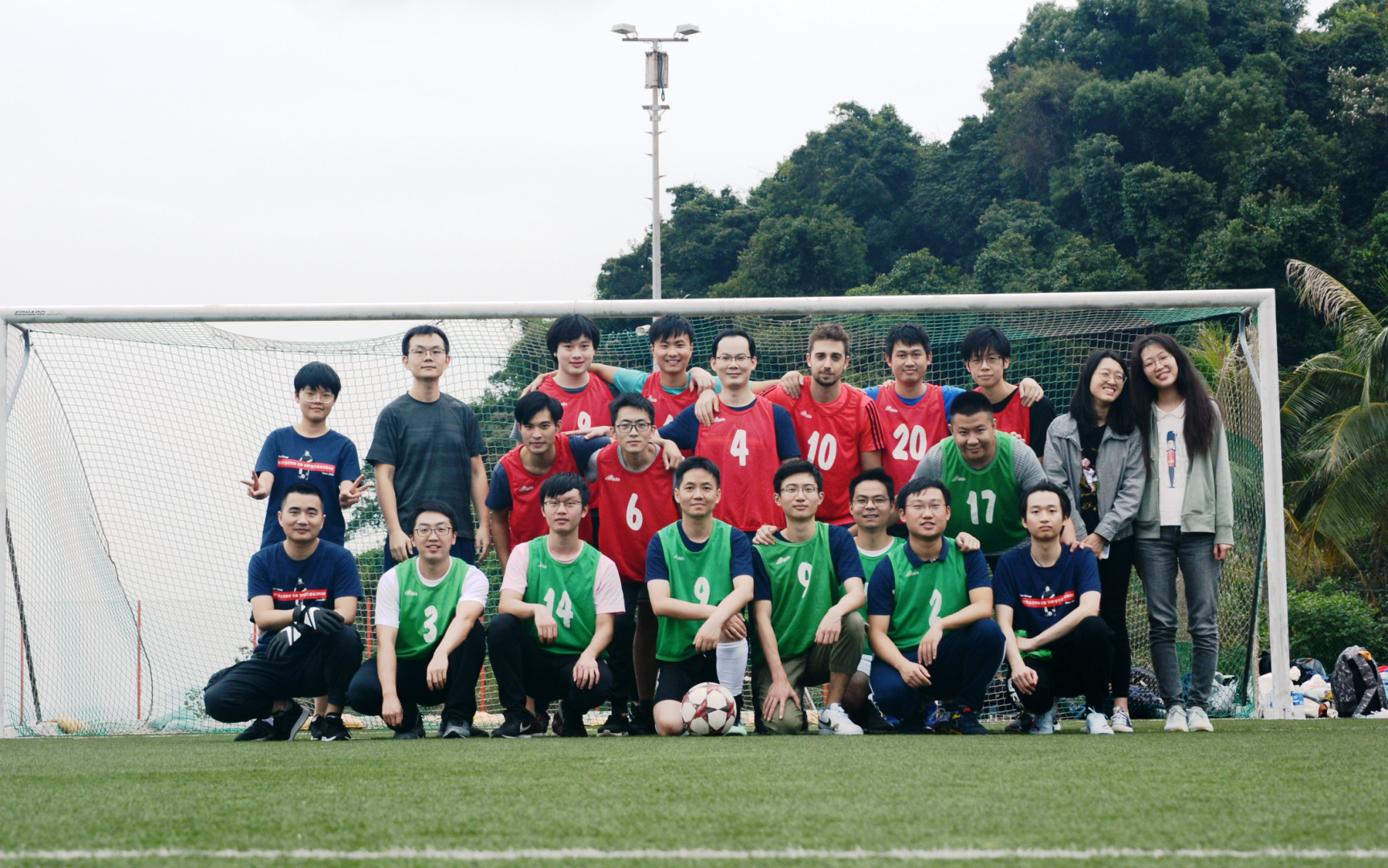 55 playing soccer with colleagues and students on campus